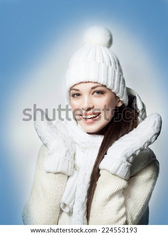 beauty face portrait of attractive young caucasian woman in warm clothing studio shot isolated on white toothy smiling winter