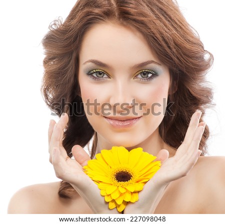 closeup portrait of attractive  caucasian smiling woman brunette isolated on white studio shot lips  face hair head and shoulders looking at camera skin makeup yellow flower spring summer