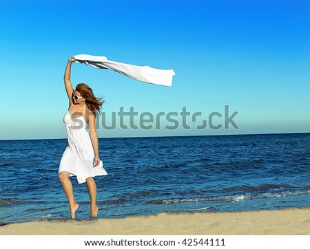 Woman  on the beach with white towel