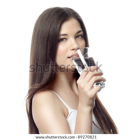 portrait of attractive  caucasian smiling woman isolated on white studio shot drinking water