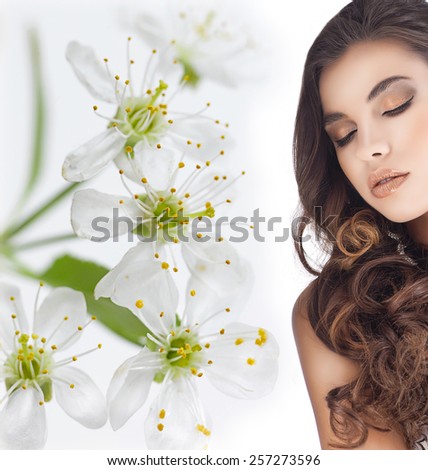 closeup portrait of attractive young caucasian  woman brunette isolated on white studio shot lips face skin long hair head and shoulders  eyes closed makeup spring flowers
