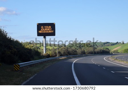 Led sign by the road Is your journey necessary  on the motorway highway Belfast to Dublin