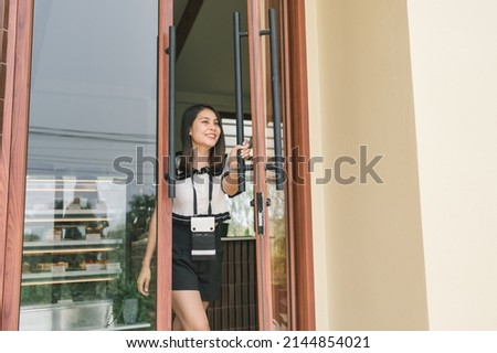 Similar – Image, Stock Photo Cheerful woman leaving restaurant