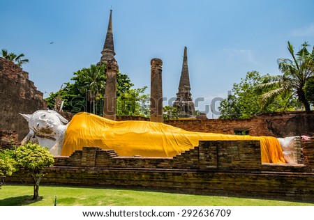 Big large white buddha sleep posture landmark in temple chaimongkol place of worship