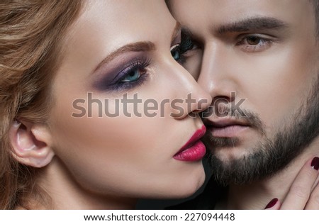 Couple portrait. Passionate couple in love.  Portrait of  beauty blond girl and her handsome boyfriend. Love. Kiss. Flirt.  Lovers. Valentines Day