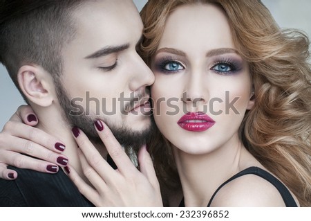Passion couple. Couple portrait. Beautiful couple in love. Blond woman hugging a man.  Portrait of  beauty blond girl and her handsome boyfriend. Love. Lovers. Valentines Day