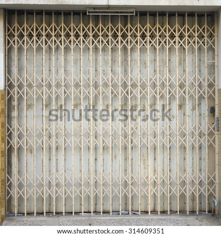 Old metal grille sliding door at old town ; Songkhla province Thailand