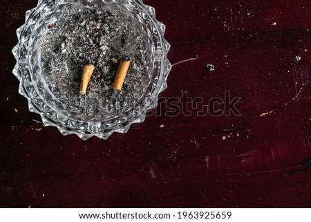 Similar – Image, Stock Photo Two cigarettes from above laying flat on pink and purple backgrounds as a symbol of female smoking