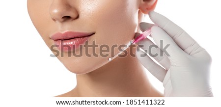 Woman receives a facelift, procedure mesothreads lifting skin. Cosmetic surgery, mesothreads lifting, and contouring face. Isolated on white Stockfoto © 