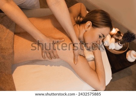 Similar – Image, Stock Photo Adult woman enjoying massage in spa salon