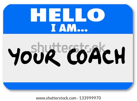A namtag sticker with the words Hello I Am Your Coach to represent your life advisor, mentor, manager, leader or other person offering moral support or help