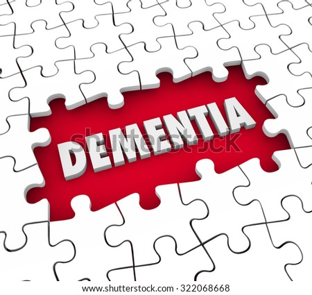 Dementia word in a hole with puzzle pieces to illustrate aging, memory loss, mind or brain degeneration and medical treatment for the condition