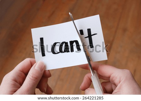 I can self motivation - cutting the letter t of the written word I can't so it says I can Imagine de stoc © 