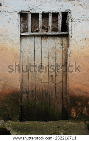dirty white old wooden village door