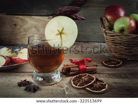 Autumn drink with spices on the wooden table
