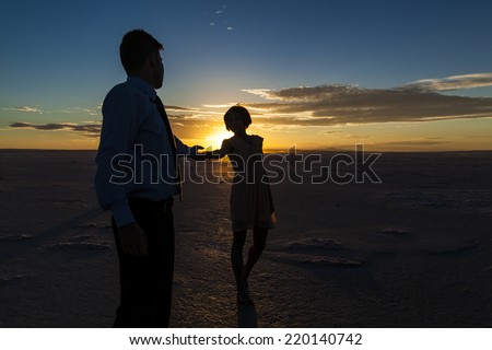 Silhouette of a  couple in love at sunset, Salt Lake-Turkey.