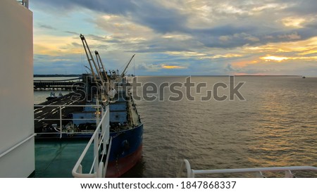View of bulk carrier vessel n Brazilian port during sunset Stock fotó © 