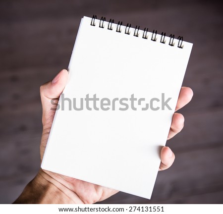 Notepad paper in hand man isolated