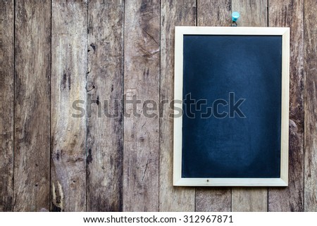 empty Blank chalkboard in wooden frame isolated on old wooden background