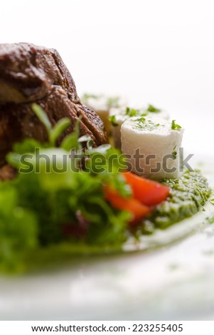 Beef roasted on green sauce with fresh cheese Beef roasted on green sauce with fresh cheese