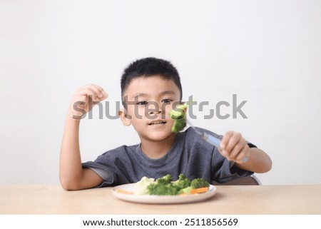 Similar – Image, Stock Photo Child eating fresh carrot