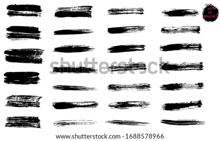 A set of brush strokes. A collection of vector black lines, for grunge design and decoration, isolated on a white background.