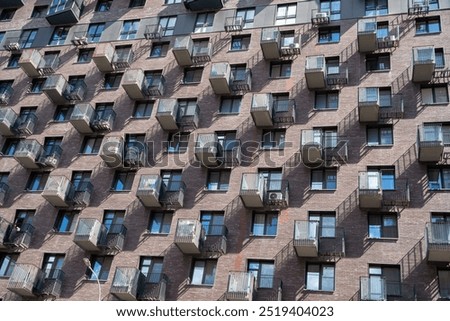 Similar – Foto Bild Hausfassade mit nach außen geöffneten Fenstern