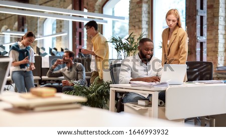 Young professionals. Group of multiracial business people working together in the creative co-working space. Team building concept. Office life. Web banner ストックフォト © 