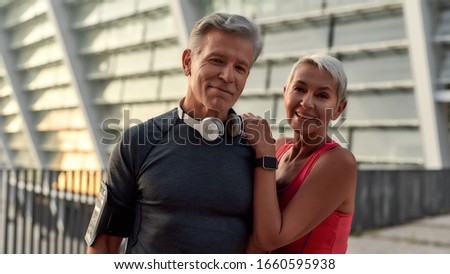 Similar – Image, Stock Photo Cheerful couple training together standing in folded leaf position on mat together in studio