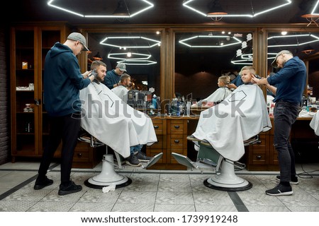 Image, Stock Photo Father making haircut for son at home