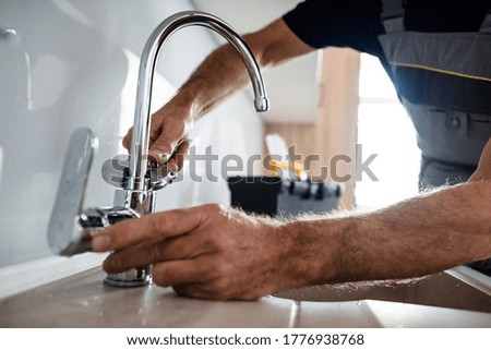 Similar – Image, Stock Photo Repairman fixing old broken motorcycle in workshop