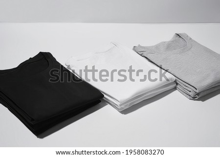 Similar – Image, Stock Photo Shirt Pile T-shirts Shirts