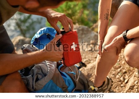 Similar – Image, Stock Photo Crop traveler with trekking poles in mountains in winter