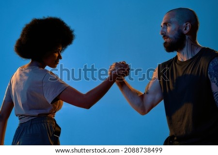 Similar – Image, Stock Photo Crop multiracial couple holding little fingers