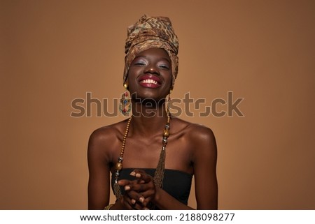 Similar – Image, Stock Photo Pleased woman in turban resting in hammock on terrace