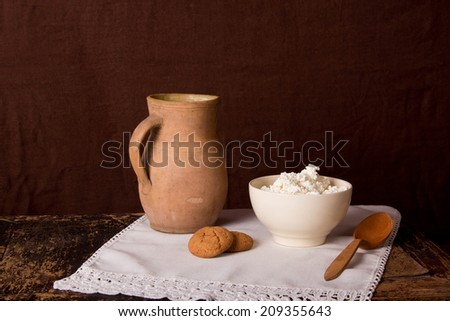 Clay jug with milk and oatmeal cookies, retro, vintage