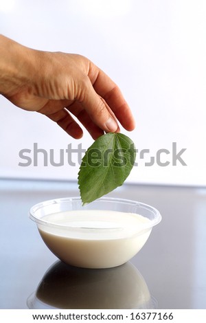 The hand of woman which prepares cream for an improvement in the skin and health