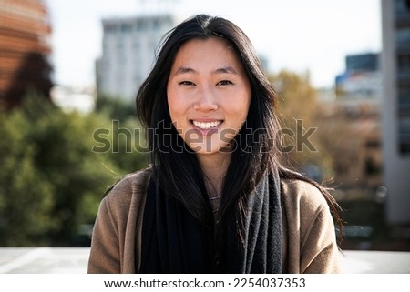 Similar – Image, Stock Photo Close portrait of a young woman standing behind a sliding gate and looking through it