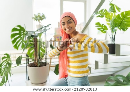 Image, Stock Photo Woman with pink scarf for cancer looking at the sea in bikini from the beach