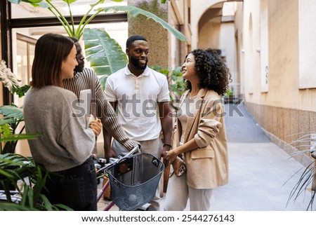 Image, Stock Photo Ethnic friends relaxing together in city