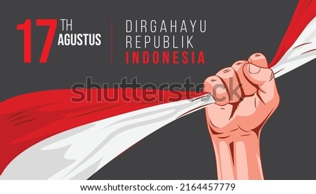 17 August. Indonesia Happy Independence Day - hand holding indonesian flag