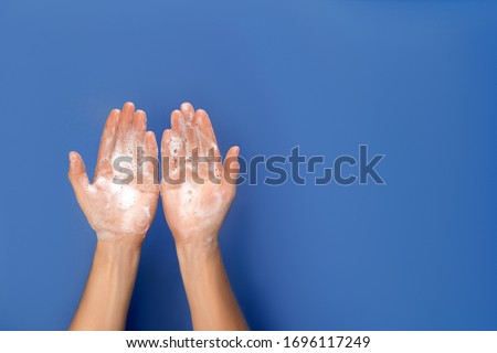 Similar – Image, Stock Photo Flatlay of woman rubbing cream in her legs in bed