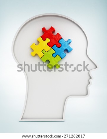 Four colored jigsaw puzzle pieces inside human head shape