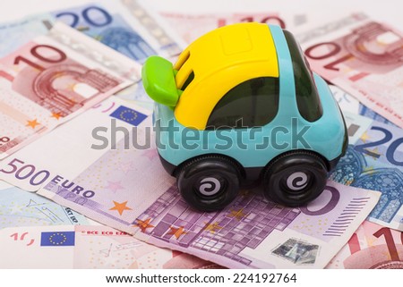 Toy car on euro money