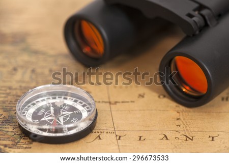 Binocular and compass on map