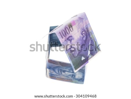House Made of Swiss francs banknotes isolated on white.Currency of Switzerland