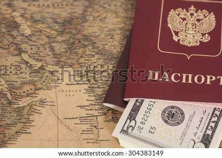 Russian International passports with dollars on the world map