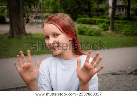 Similar – Image, Stock Photo Funny girl showing dirty hands