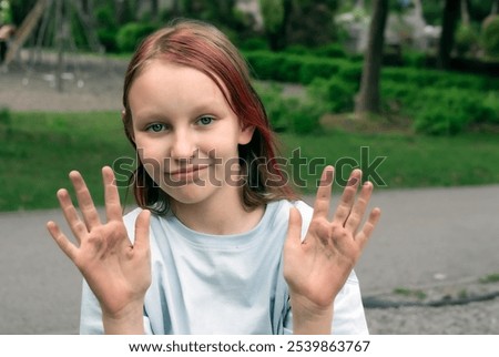 Similar – Image, Stock Photo Funny girl showing dirty hands