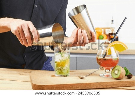 Similar – Image, Stock Photo Woman pouring cocktail in metal mug